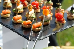 canapes on a stick on a graphite tray